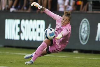 Angel City FC goal keeper Didi Haracic (13) stops a shot during the first half of an NWSL soccer.