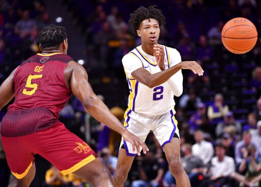 LSU guard Eric Gaines (2) passes the ball away from Louisiana-Monroe guard Reginald Gee (5) during an NCAA college basketball game Tuesday, Nov. 9, 2021, at the LSU PMAC in Baton Rouge, La. (Hilary Scheinuk/The Advocate via AP)