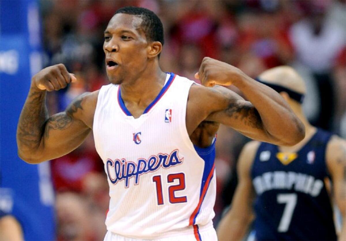 Clippers guard Eric Bledsoe flexes his muscles after making a basket against the Memphis Grizzlies.