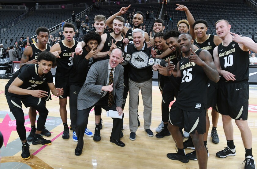 Colorado Buffaloes with the Pac-12 championship belt after their victory over Clemson on Nov. 26, 2019, in Las Vegas.
