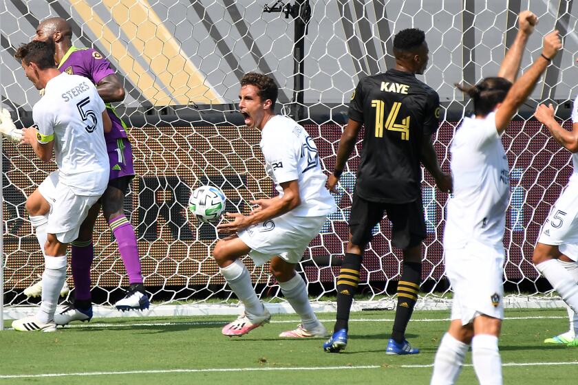 The Galaxy's Ethan Zubak, center, celebrates his goal against LAFC in the first half Aug. 22, 2020.