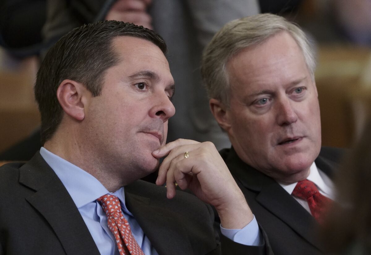 Rep. Devin Nunes, R-Calif, left, speaks with then Rep. Mark Meadows, R-N.C., on Capitol Hill in Washington. 
