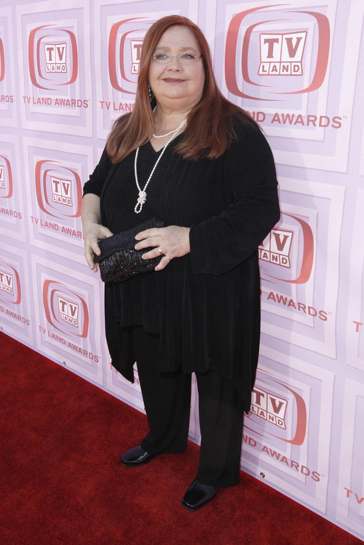 Conchata Ferrell stands on a red carpet in 2009