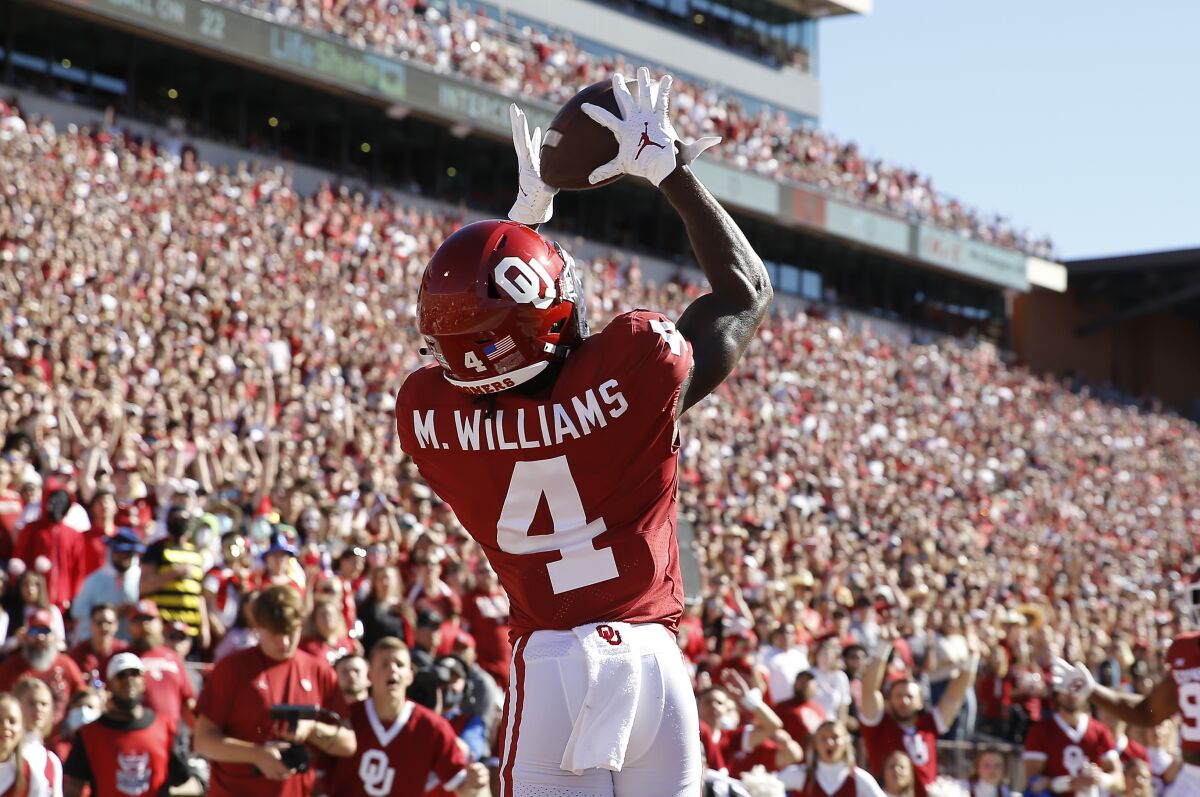 Oklahoma wide receiver Mario Williams makes a catch for a touchdown during a game in October.