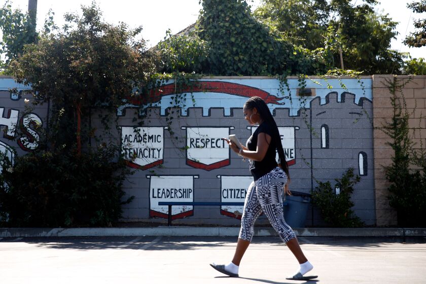 LOS ANGELES, CA-AUGUST 26, 2019: Kamryn Johnson walks towards an after school dance class on August 26, 2019 in Los Angeles, California. Johnson is a student at ICEF View Park Prep Charter High School, across the street from the Marathon store where Nipsey Hussle was shot and killed earlier this year. (Photo By Dania Maxwell / Los Angeles Times)