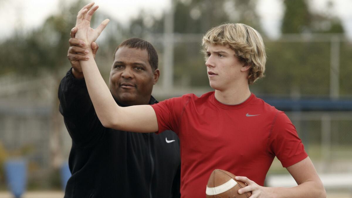 David Sills, then 15, works with quarterback coach Steve Clarkson on Dec. 17, 2011, at Venice High.