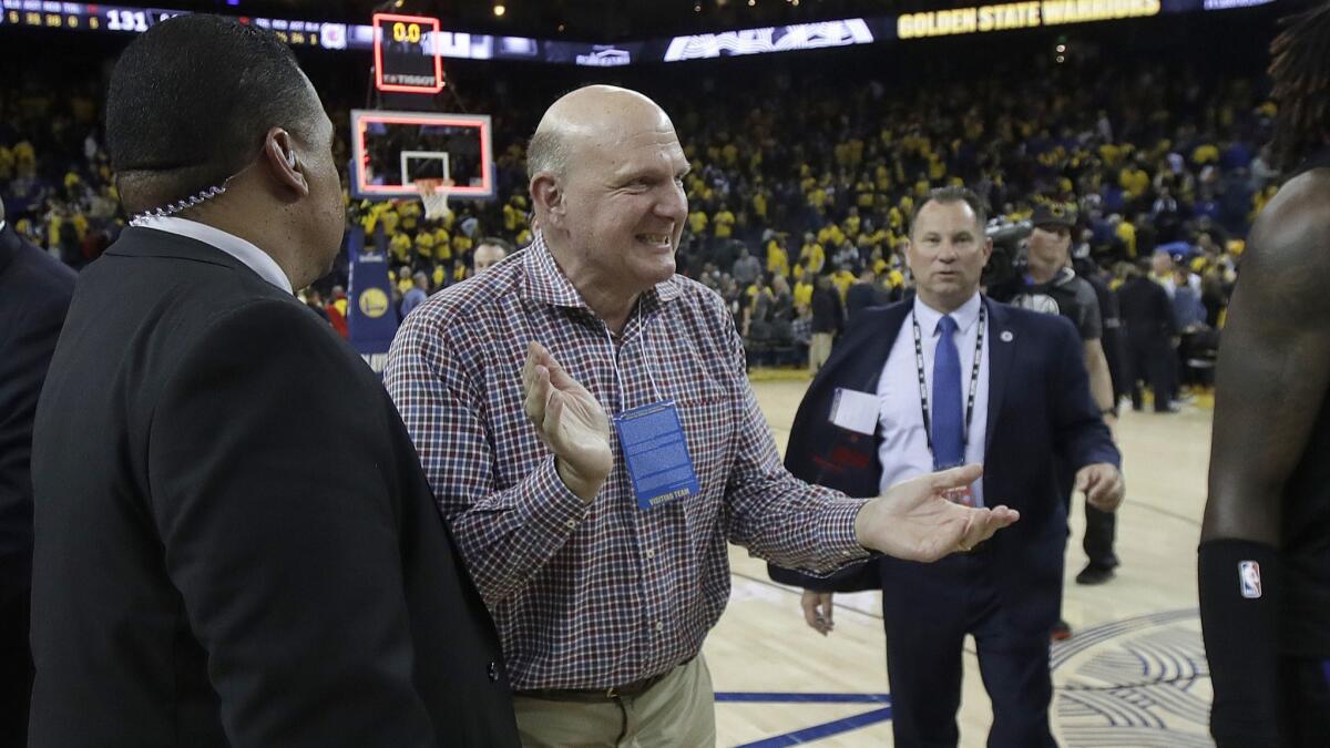 Clippers owner Steve Ballmer celebrates after his team rallied to beat the host Warriors in Game 2 of their Western Conference first-round playoff series Monday night.