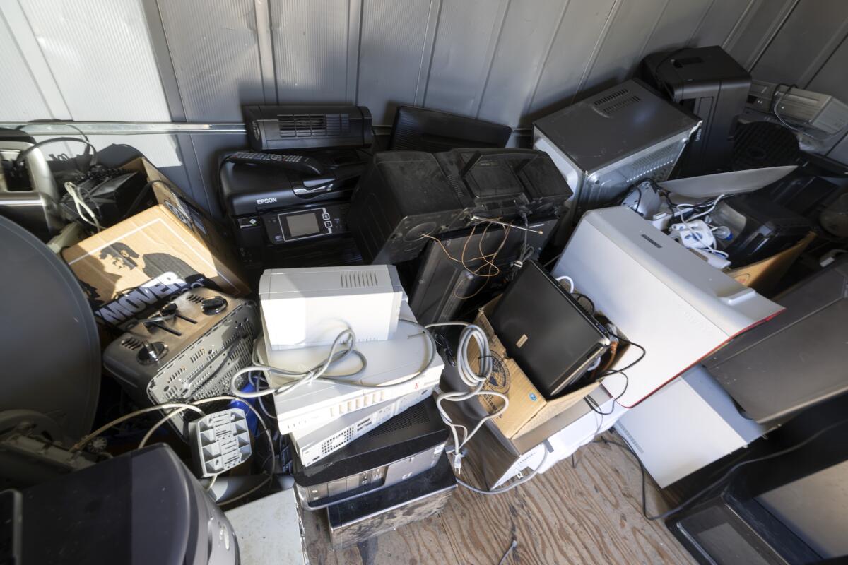 A shed holds items for e-waste recycling, another service provided at the center.