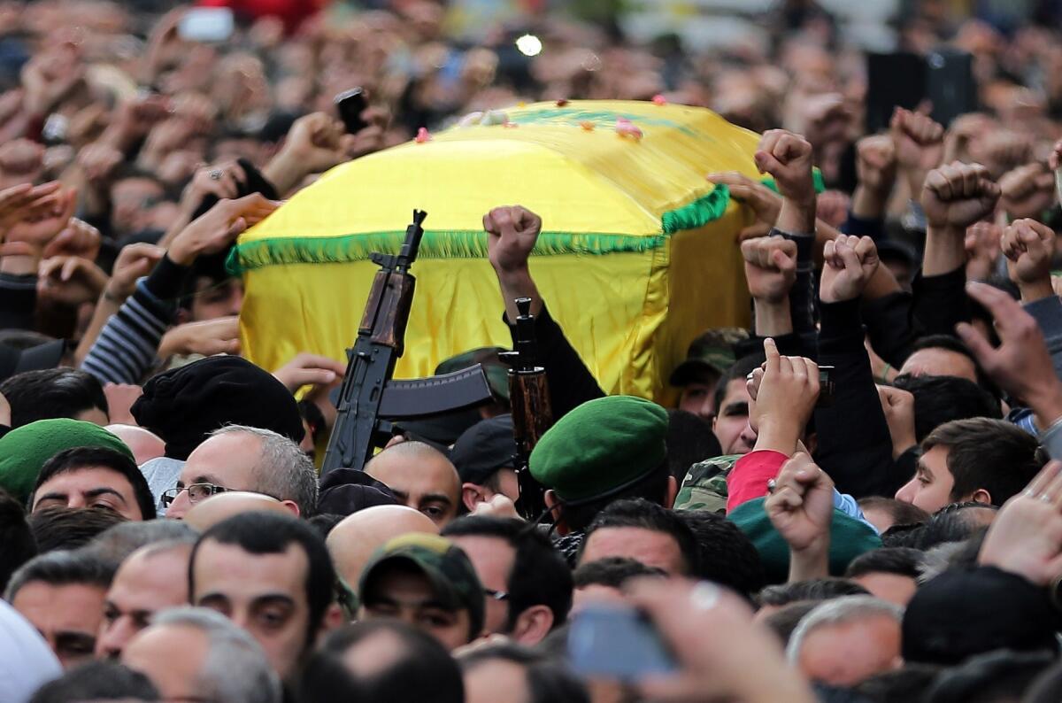 Lebanese Hezbollah supporters carry the coffin of militant Jihad Mughniyeh during his funeral in a southern Beirut suburb.