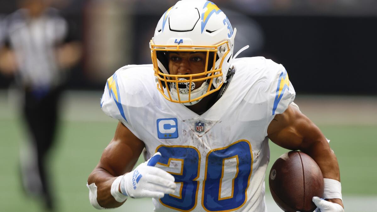 Chargers running back Austin Ekeler carries the ball up field.