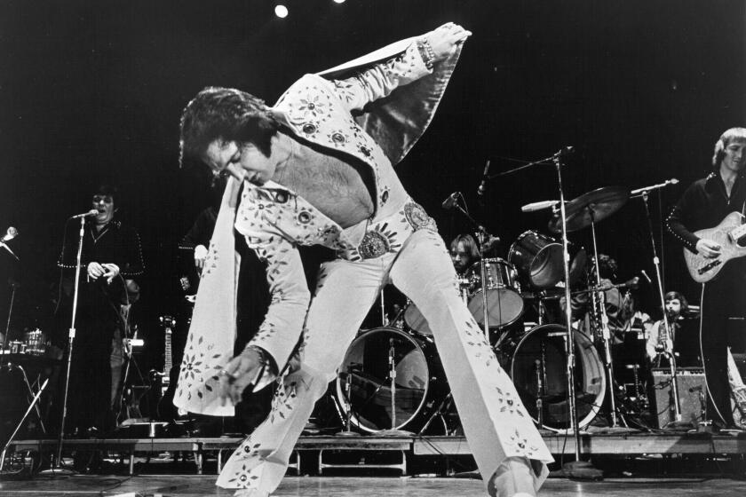 1972: Rock and roll singer Elvis Presley performs on stage in 1972. (Photo by Michael Ochs Archives/Getty Images)