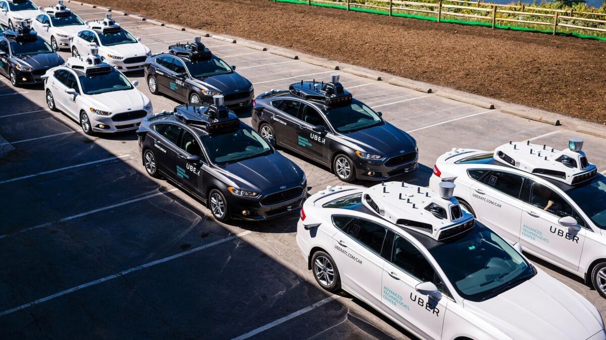 Pilot models of the Uber self-driving vehicle are displayed in 2016 in Pittsburgh.