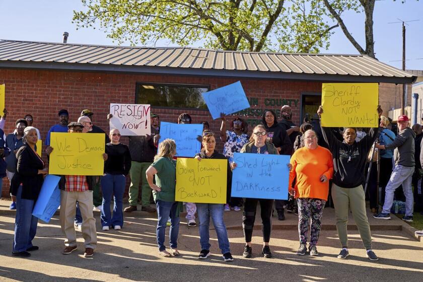 In this photo provided by the Southwest Ledger, McCurtain County residents call for the resignation of several McCurtain County officials after tapes with the officials' racist comments surfaced over the weekend, in Idabel, Okla., Monday, April 17, 2023. (Christopher Bryan/Southwest Ledger via AP)