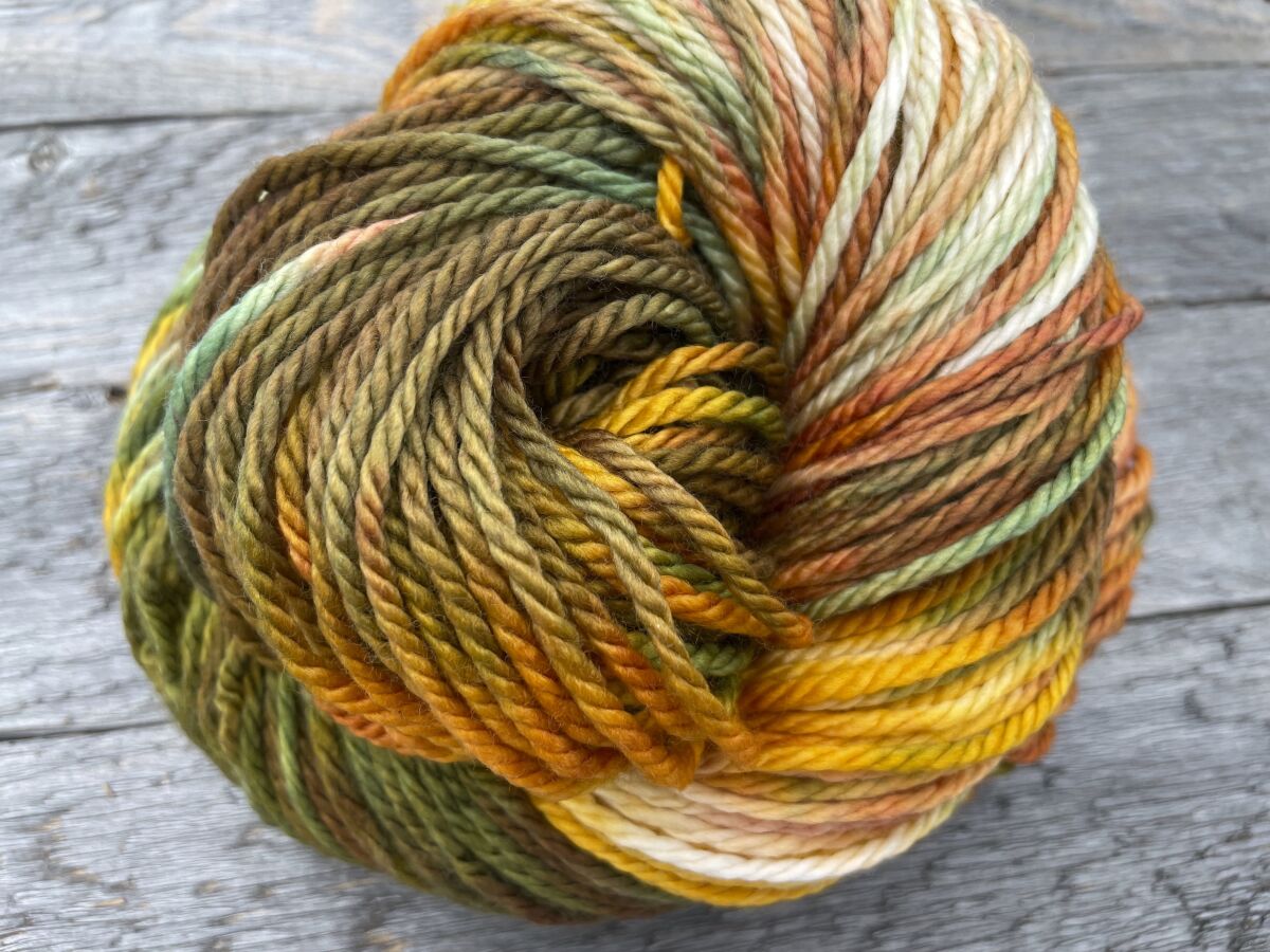 This photo provided by Ravenswood Fibre Co. shows some of their wool. Ravenswood Fibre Co's Sam Myhre celebrates the fall with her Autumn Grandeur colorway, a mix of softly-blended golds, rusts, greens and browns. (Ravenswood Fibre Co. via AP)