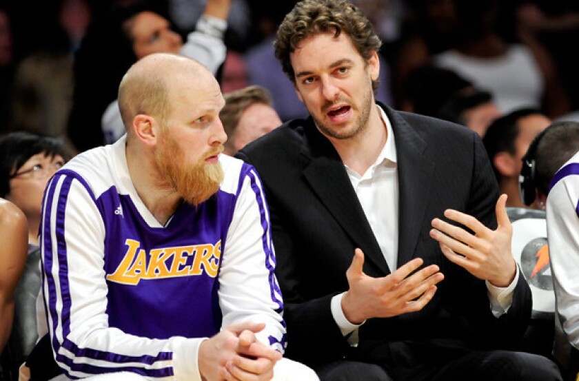 Lakers center Chris Kaman, left and might join power forward Pau Gasol in street clothes for the game Wednesday night against the Sacramento Kings.
