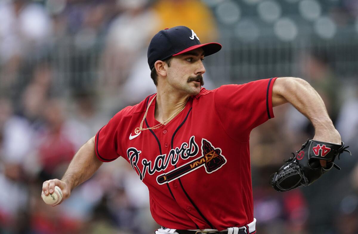 Atlanta Braves starting pitcher Spencer Strider (65) delivers in the first inning of the team's baseball game against the Pittsburgh Pirates on Friday, June 10, 2022, in Atlanta. (AP Photo/John Bazemore)