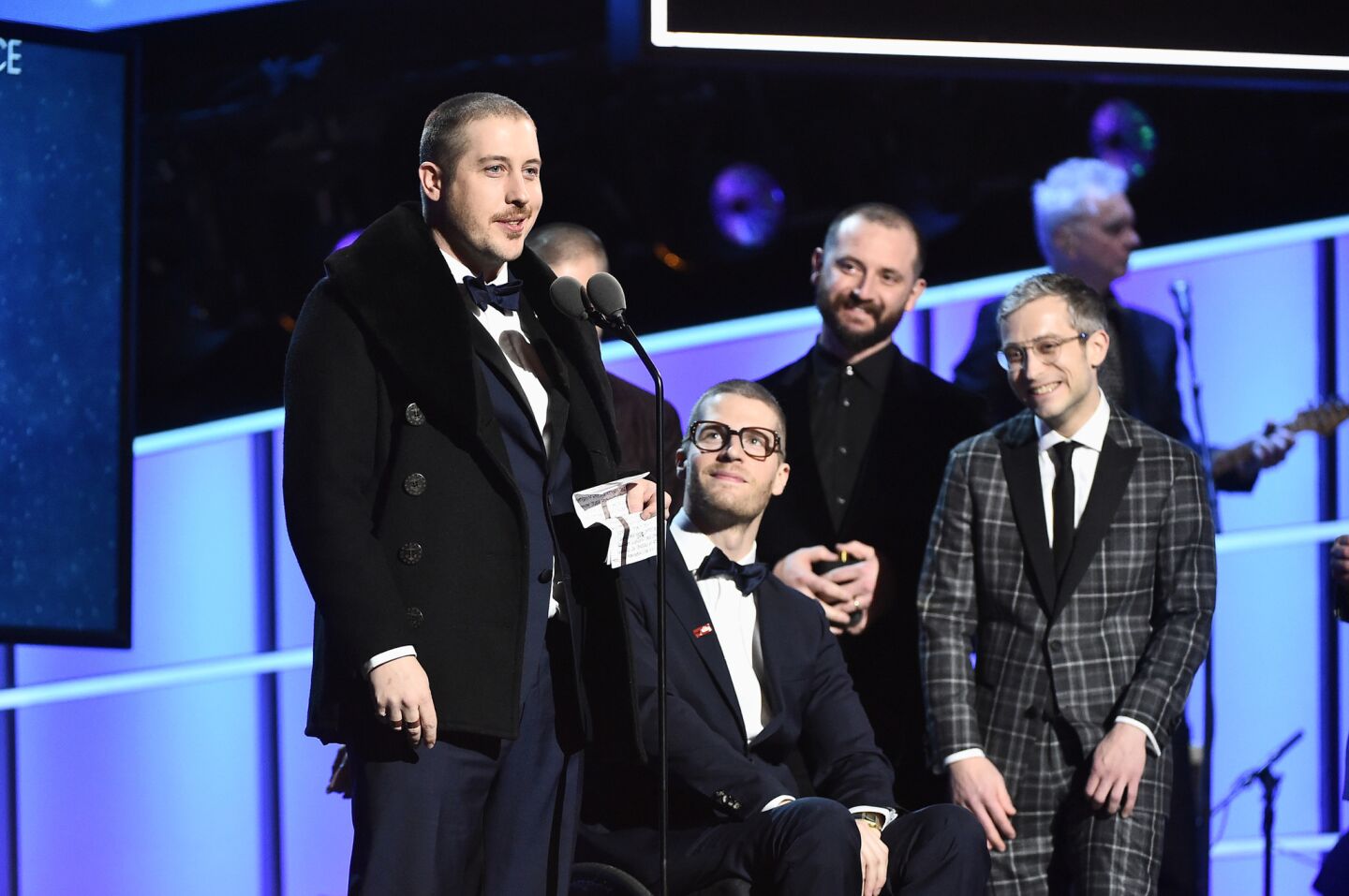 Left to right, recording artists Zachary Scott Carothers, Eric Howk, Jason Wade Sechrist, Kyle O'Quin of Portugal. The Man, winners of pop duo/group performance for "Feel It Still," accept the award at the pre-telecast show.
