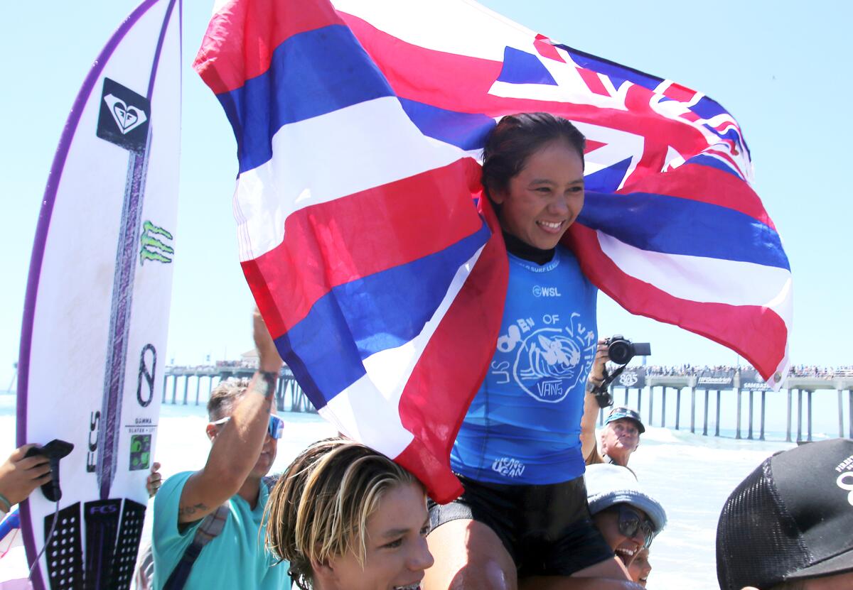 Bettylou Sakura Johnson of Hawaii celebrates after winning the 2022 U.S. Open of Surfing women's title last August.