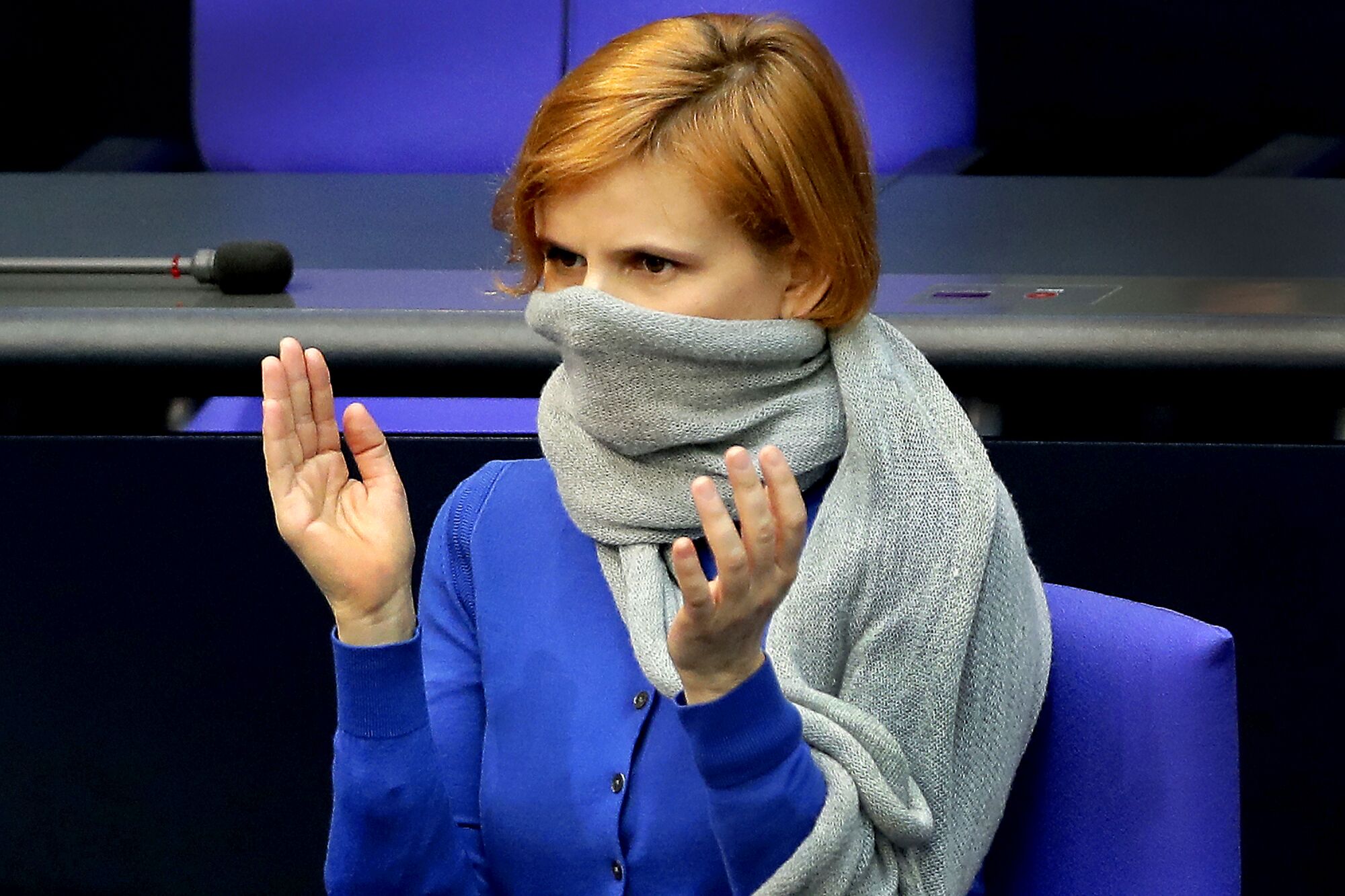 GERMANY: Katja Kipping, co-chairwoman of the German Left Party, wears a scarf as a face mask during a meeting of the German federal parliament, the Bundestag, at the Reichstag building in Berlin.