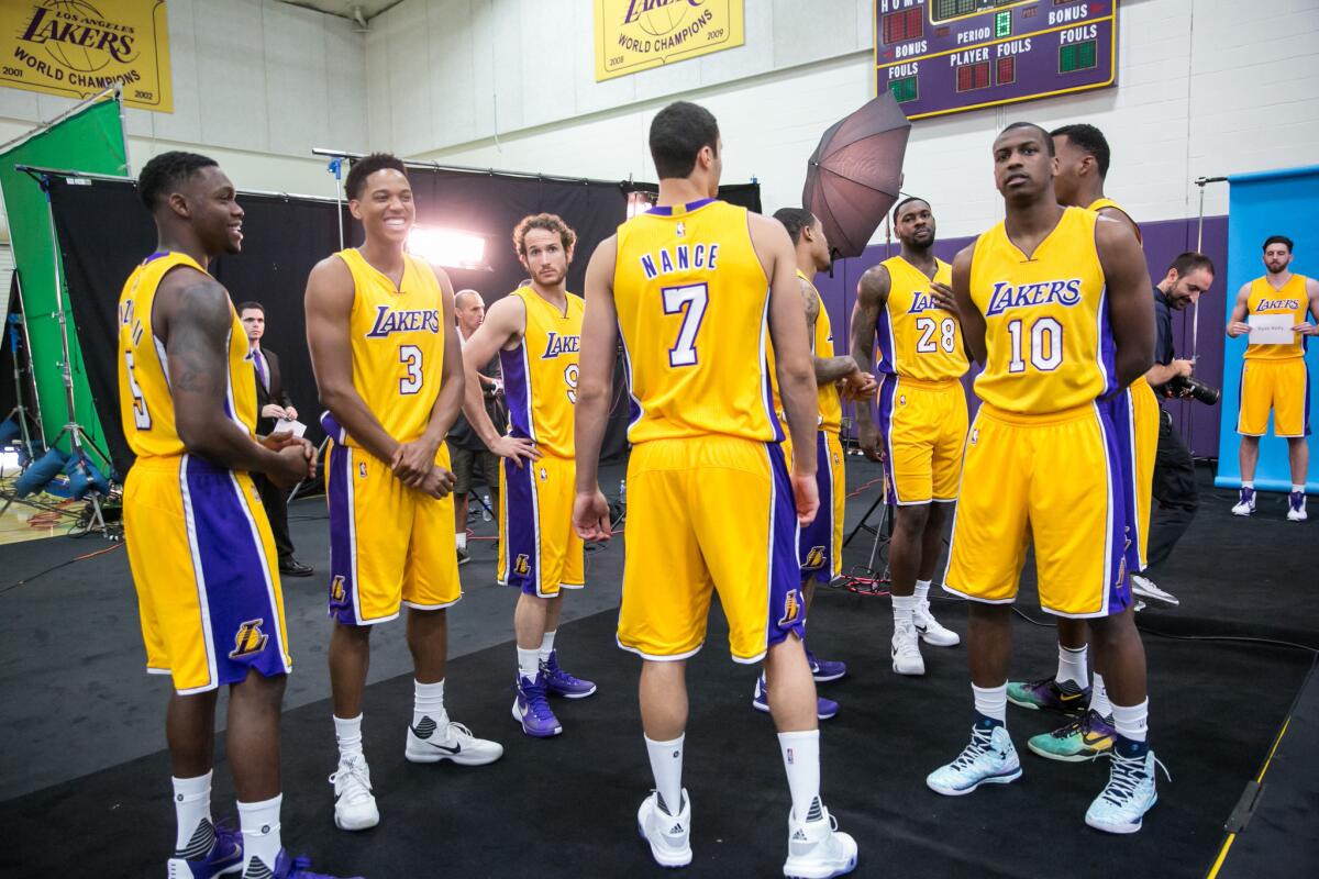 Lakers players wait in line to be photographed at media day in El Segundo on Sept. 28.