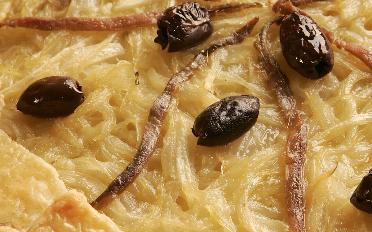 Onion tart with anchovies and olives