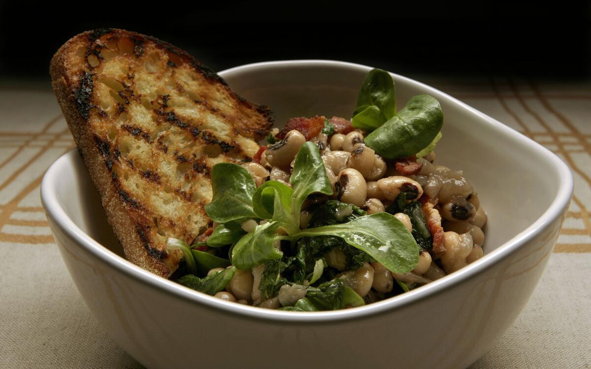 Warm salad of black-eyed peas, wilted mustard greens and bacon