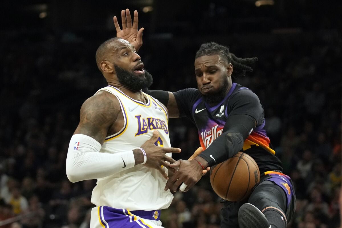 Suns forward Jae Crowder strips the ball from Lakers forward LeBron James.