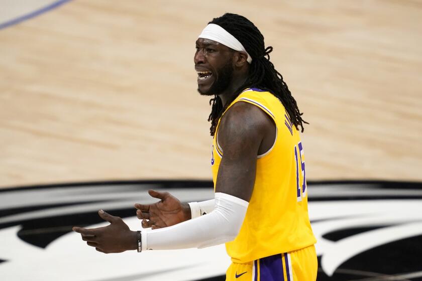 Los Angeles Lakers' Montrezl Harrell (15) shouts at an official during an NBA basketball game.