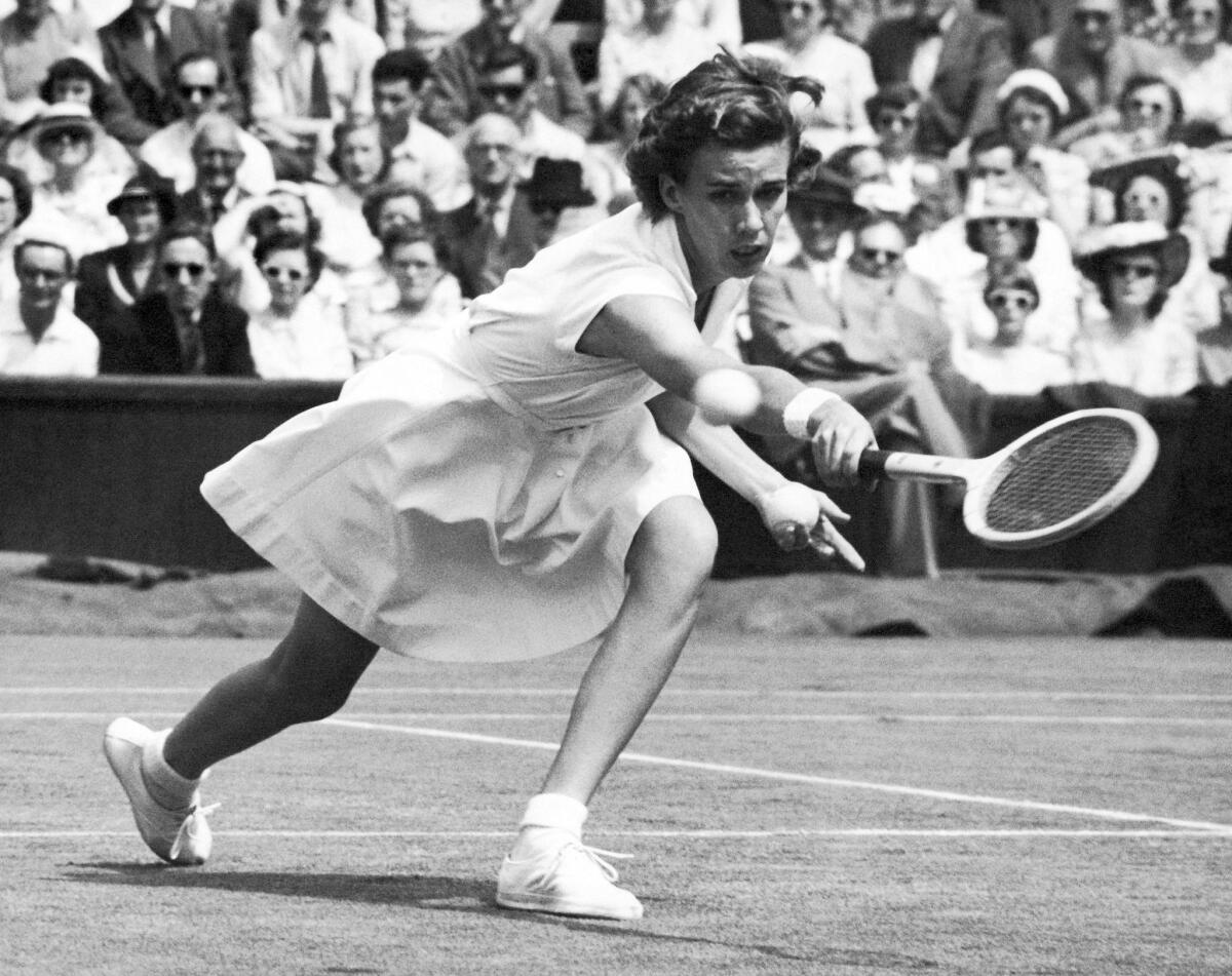 Doris Hart competes in a singles tennis match at Wimbledon in London in June 1951, when she won three Wimbledon titles in a single day. Hart, who won each Grand Slam tournament at least once, died Friday, May 29, 2015, at her Miami area home.