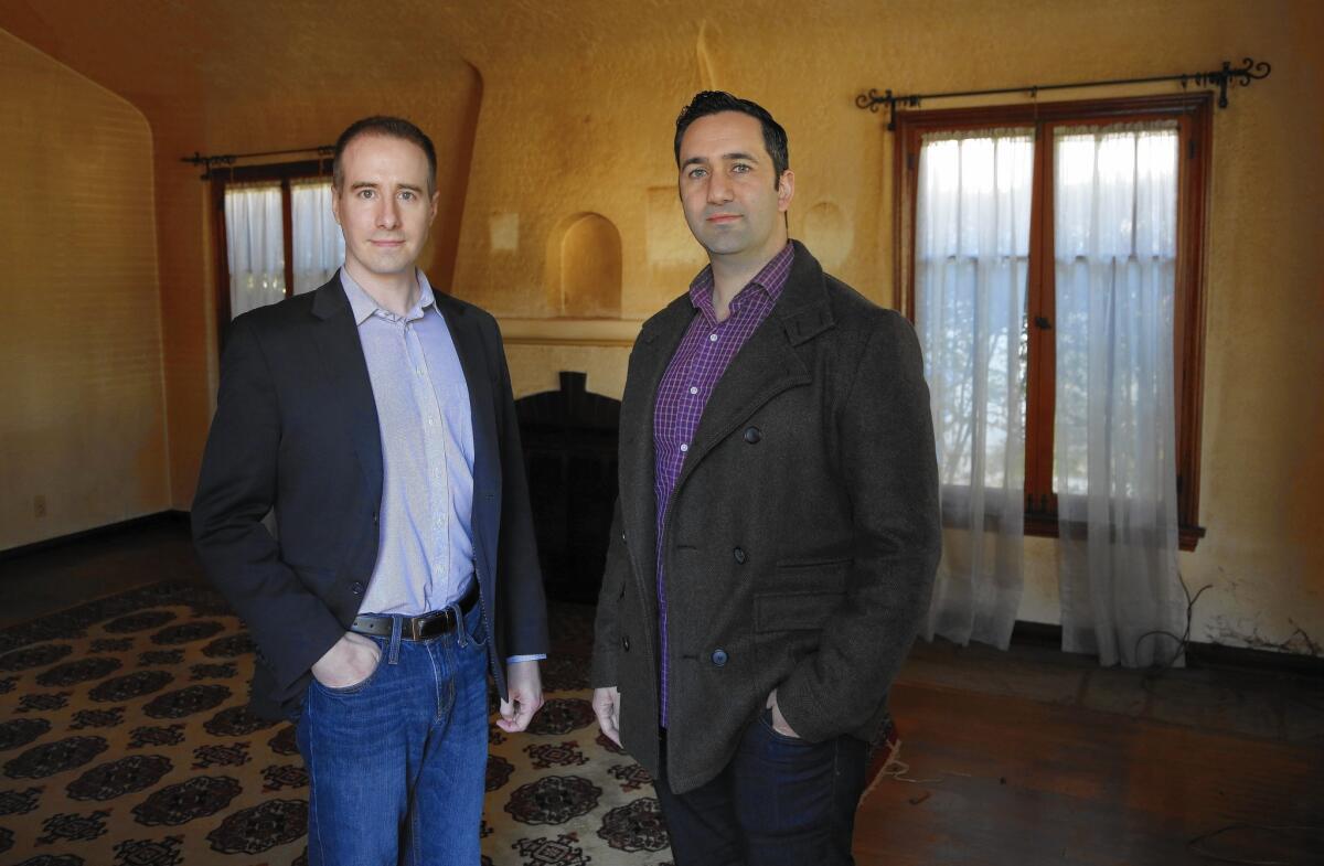 Jason Fritton, CEO of the crowdfunding platform Patch of Land, left, and David Berneman of Golden Bee Properties in one of the homes they plan to renovate.