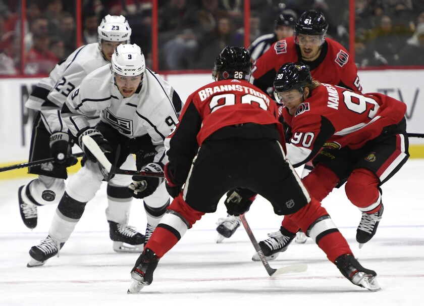 Kings left wing Adrian Kempe (9) makes his way down the ice as Senators defenseman Erik Brannstrom (26) and center Vladislav Namestnikov (90) defend during the first period of a game Nov. 7.
