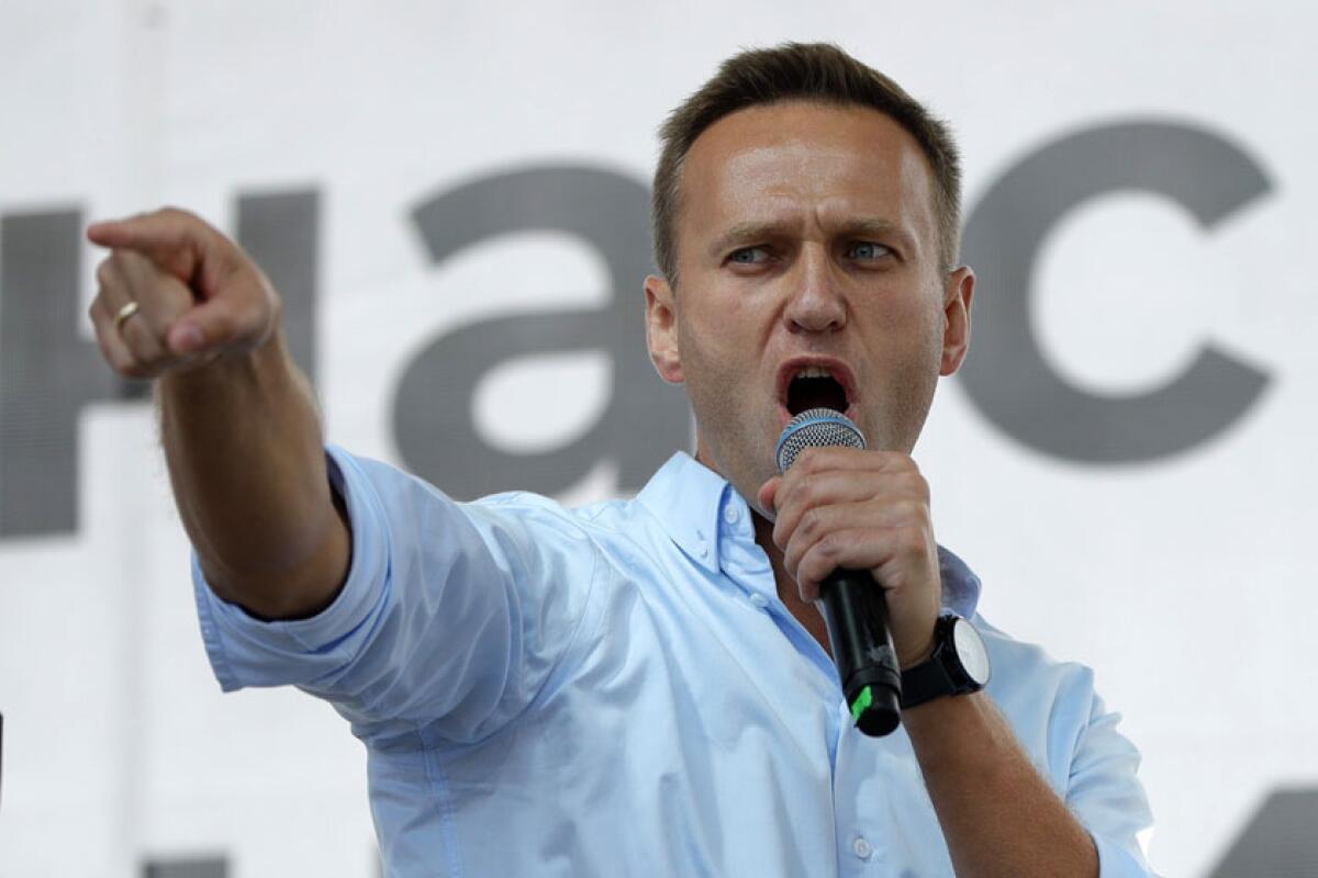 Activist Alexei Navalny, shown speaking at a public event, fell ill on Aug. 20 on a domestic flight in Russia.