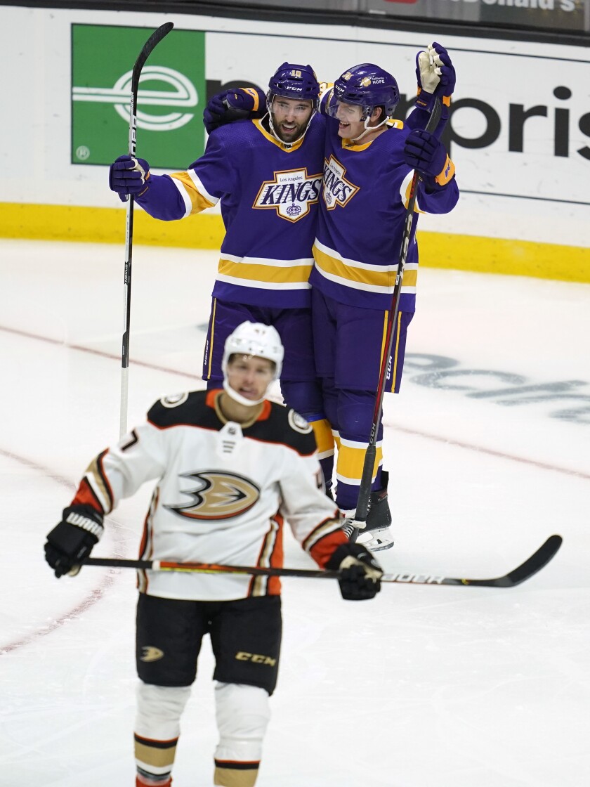 Kings right wing Arthur Kaliyev celebrates with center Michael Amadio.