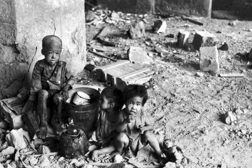TO GO WITH STORY "WWII-HISTORY-PHILIPPINES-MANILA" This handout picture dated 1945 and received 12 August 2005 from the Edgar Krohn Picture Collection shows starving Filipino children in the ruins of the city of Manila, destroyed in fighting between US troops and Japanese occupation forces in 1945 at the close of World War II. The Battle for Manila lasted just 28 days. When it ended 03 March 1945, over 100,000 civilians were dead and the city known as the Pearl of the Orient reduced to rubble. EDITORIAL USE ONLY AFP PHOTO/EDGAR KROHN PICTURE COLLECTION/HO (Photo credit should read AFP/AFP/Getty Images) ORG XMIT: JEN112