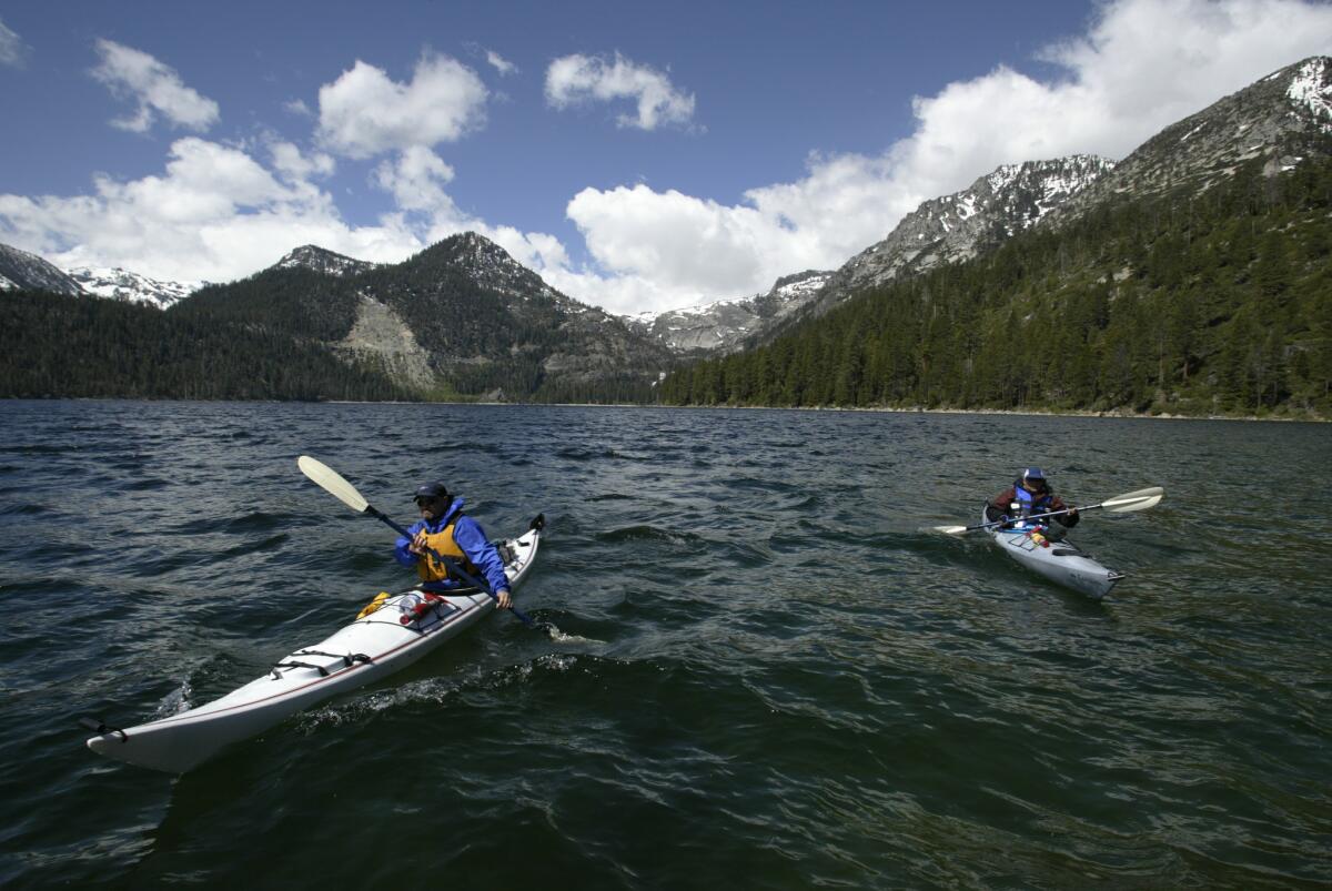 Kayakers paddle out of Emerald Bay on Lake Tahoe.