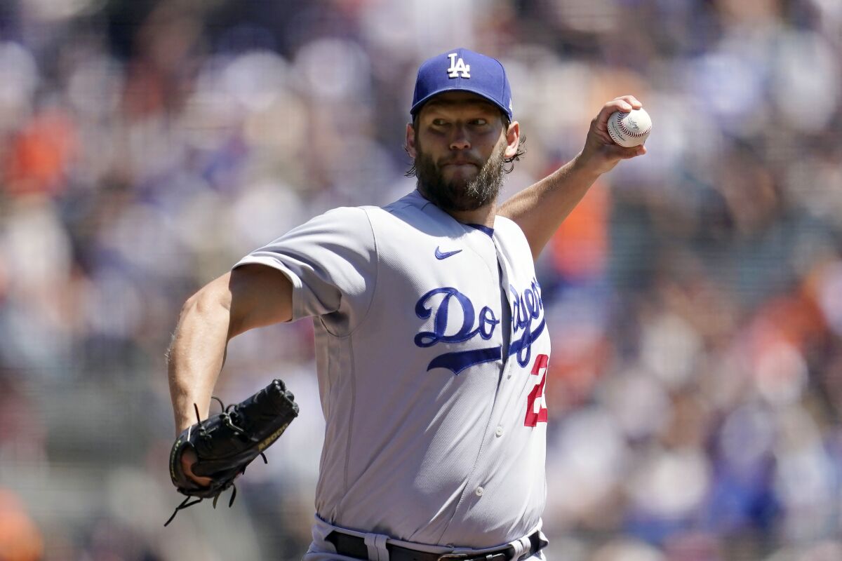 Los Angeles Dodgers' Clayton Kershaw pitches against the San Francisco Giants during the first inning of a baseball game in San Francisco, Thursday, Aug. 4, 2022. (AP Photo/Jeff Chiu)