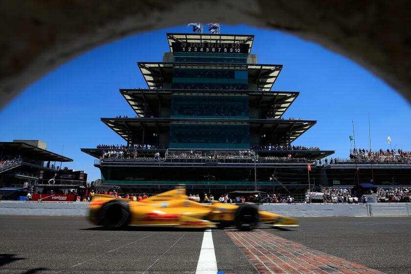 Ryan Hunter Reay guides his car arcoss the finish line in front of the pagoda-style center at Indianapolis Motor Speedway during the Indy 500 on Sunday.