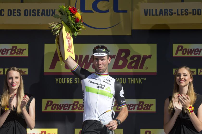 FILE - Stage winner Britain's Mark Cavendish celebrates on the podium after the fourteenth stage of the Tour de France, in Villars-les-Dombes, France, Saturday, July 16, 2016. Mark Cavendish wants another go at the record for most career stage wins at the Tour de France he shares with Eddy Merckx. After announcing his retirement earlier this year, the ace sprinter has backpedaled and will compete with the Astana Qazaqstan team for one more season. (AP Photo/Peter Dejong, File)