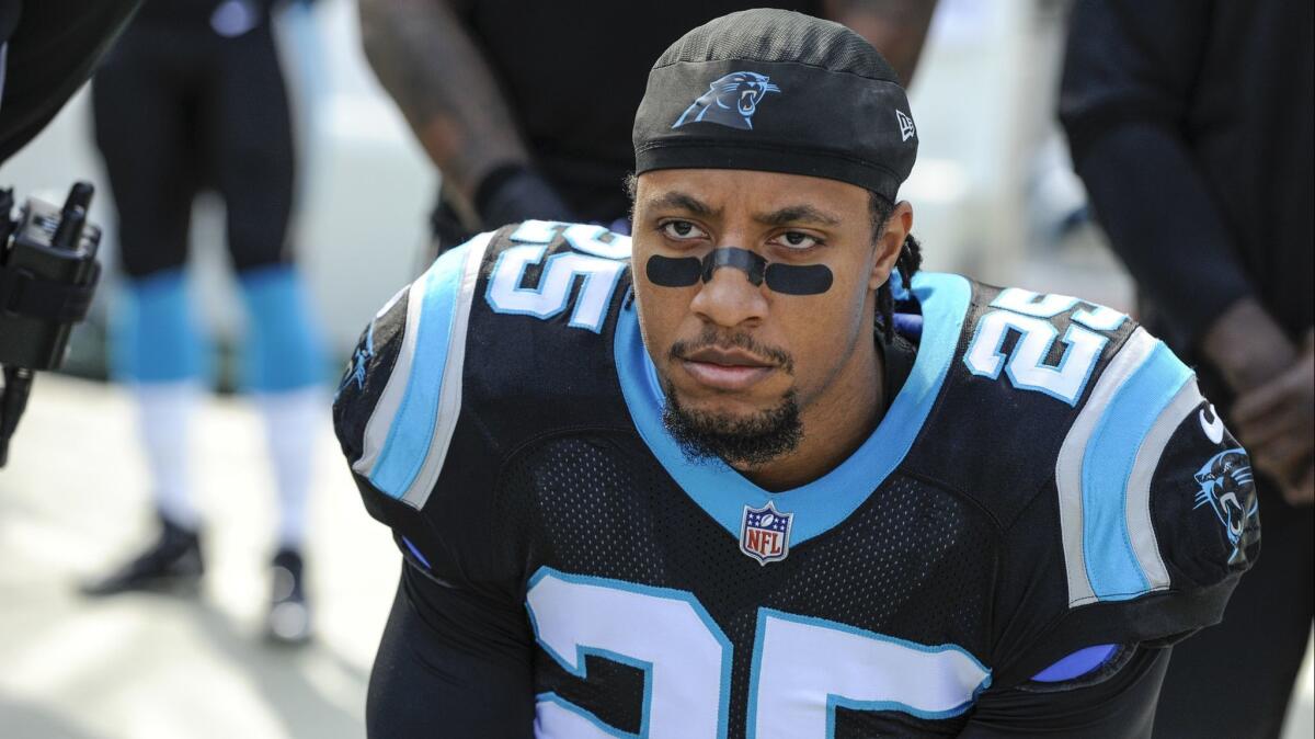 Carolina safety Eric Reid kneels during the national anthem before a Nov. 25 game against Seattle.