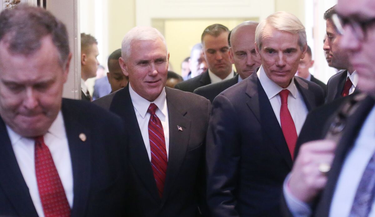 Sen. Rob Portman (R-Ohio), right, with Vice President Mike Pence at a Republican policy lunch.