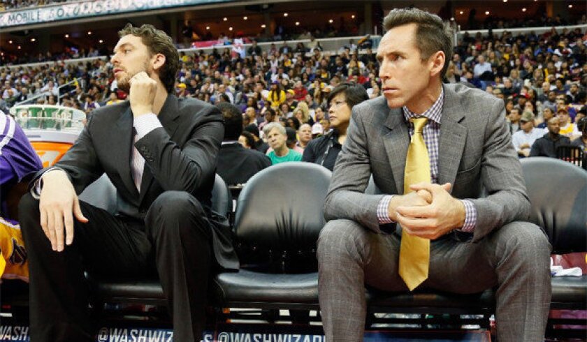 Pau Gasol, left, and Steve Nash could only watch when the Lakers played the Washington Wizards earlier this month; now Gasol is back, and Nash expects to return no later than Christmas.