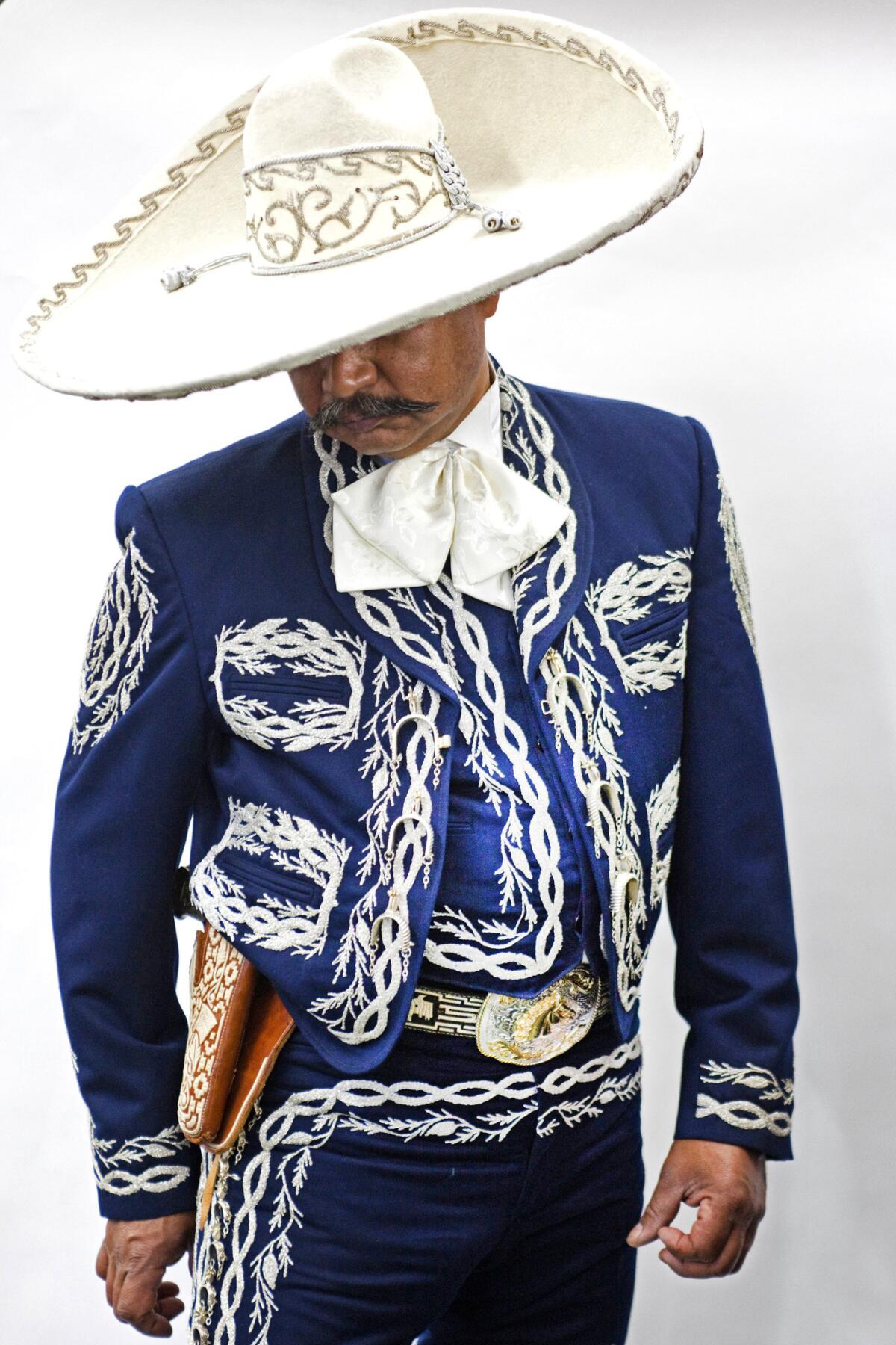 Mariachi Francisco Leyva looks gooood in his $1,300 Tello suit.