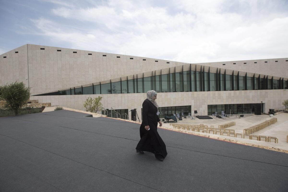 A woman tours the new Palestinian Museum for Arts and History during the opening ceremony last week.