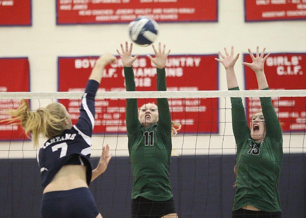 Sage Hill's Jade Blevins (11) and teammate Sydnee Francis (15) go up for a block against St. Margaret's on Tuesday.