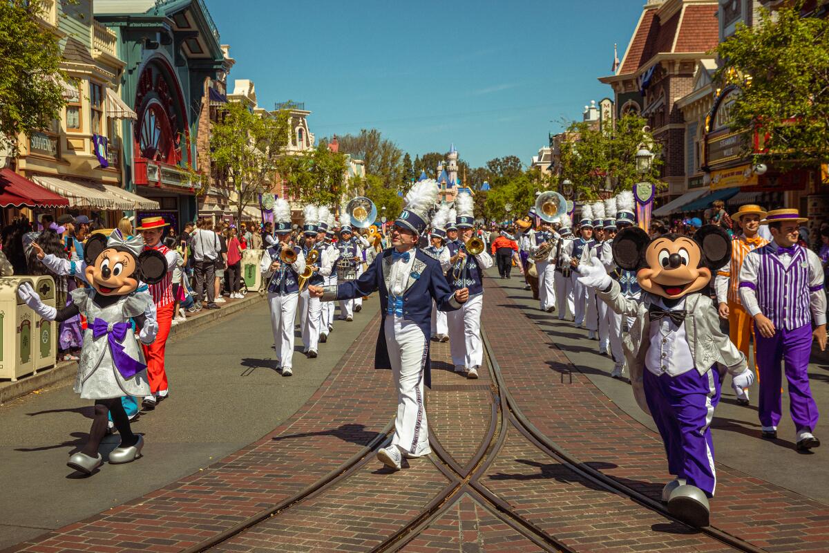 A marching band plays on Main Street at Disneyland in Anaheim on March 18. 