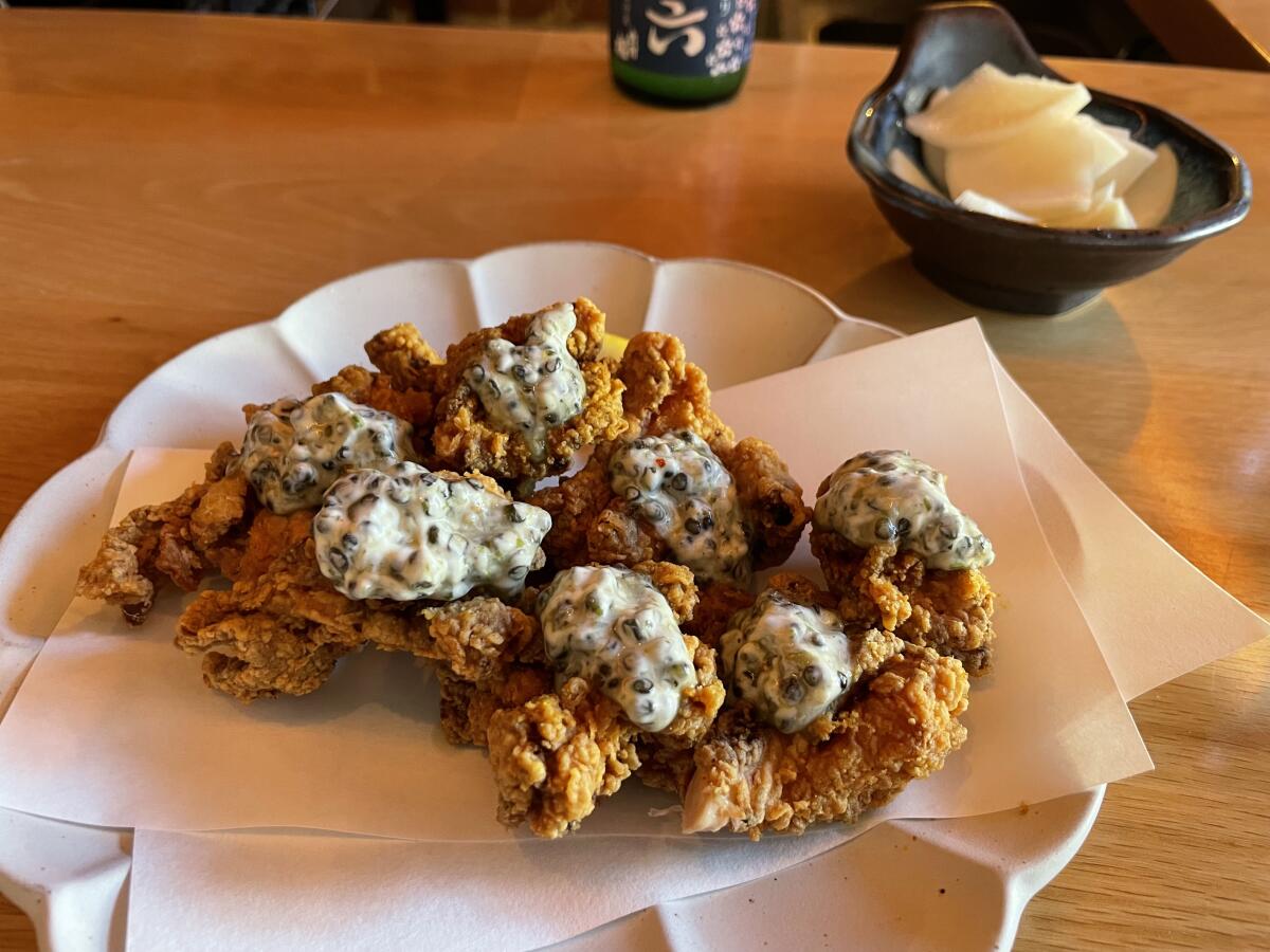 Bite-sized fried chicken on a plate.