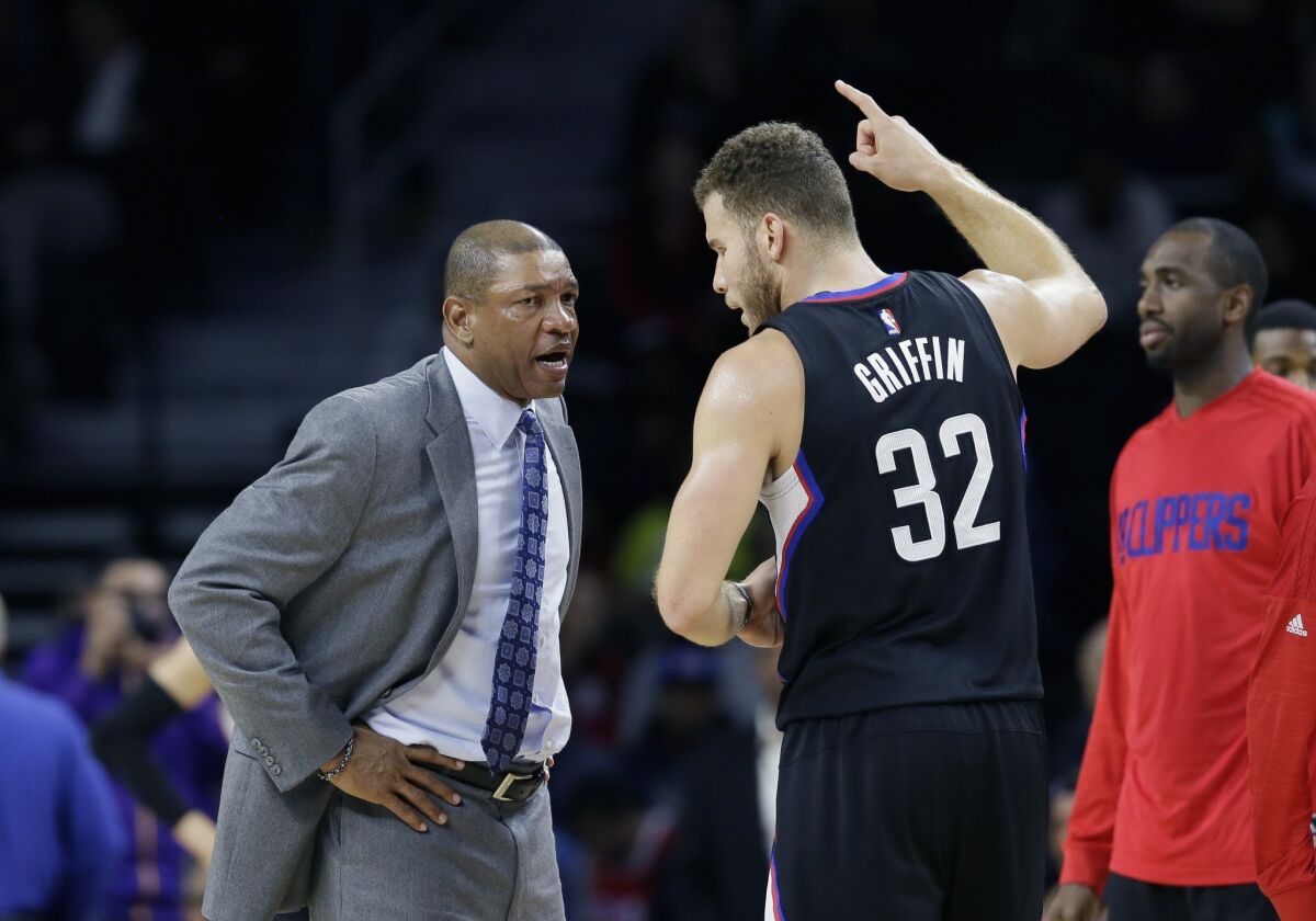Clippers Coach Doc Rivers talks with Blake Griffin during a game against Detroit on Dec. 14.