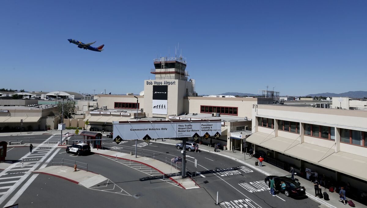 A Southwest airplane takes off over the tower at Bob Hope Airport in Burbank on March 24. 