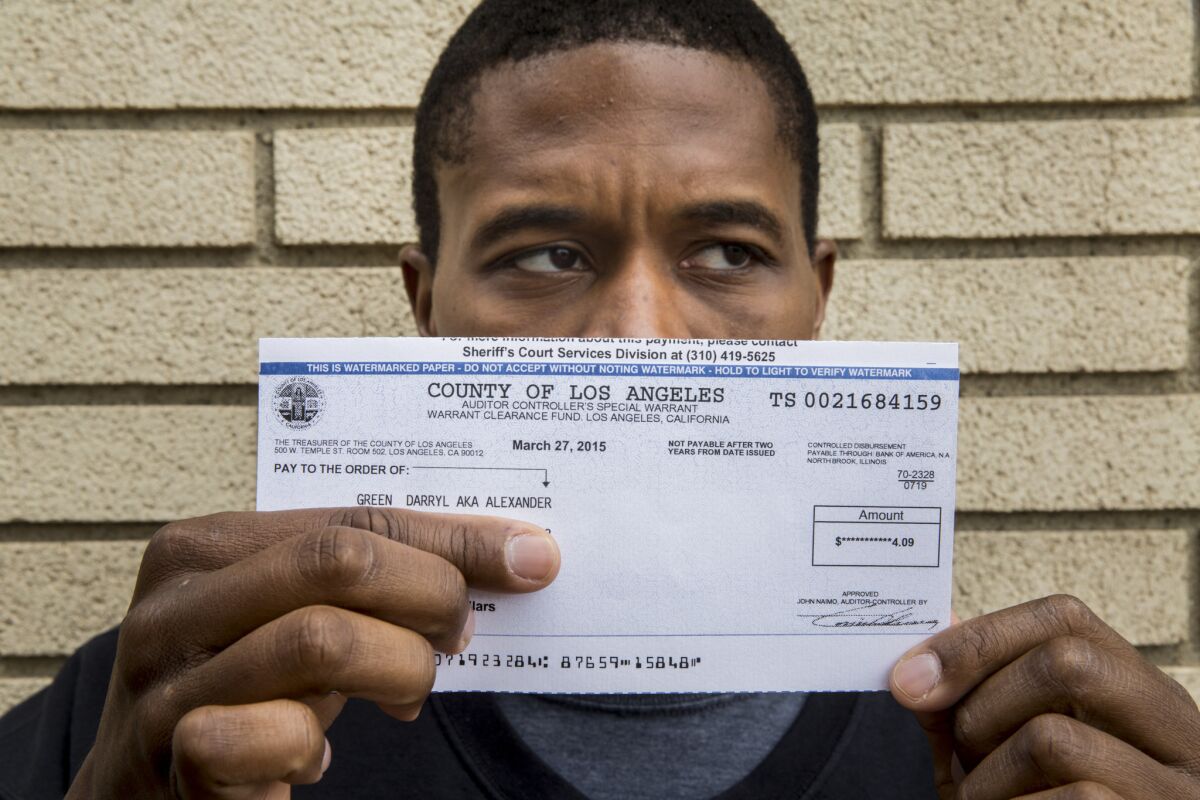 A check for $4.09 that actor Darryl Green received after winning a Small Claims Court case against Pinkerton Model & Talent Co.