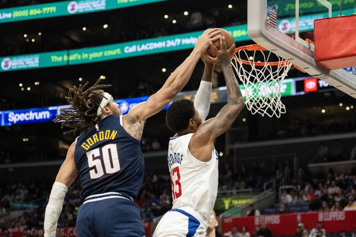 Denver Nuggets forward Aaron Gordon tries to block Clippers forward Paul George in the second half.